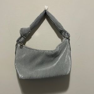 A New Day clutch bag in velvet baby blue with cross body strap.